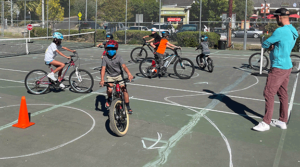 Image of children on a bicycle course marked with chalk